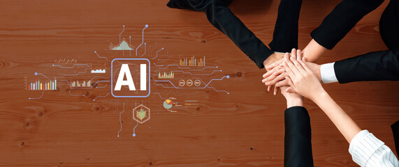 A diverse business team collaborates around a wooden table, showcasing hands united over an AI...
