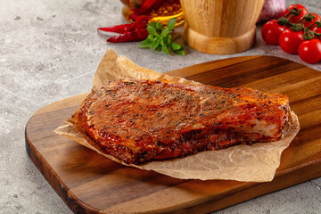 Raw marinated pork loin steak