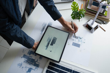 Engineer Design green energy technology with solar panel and wind turbine