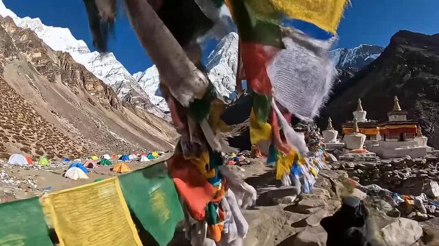 POV trekking Everest base camp, prayer flags flapping against Himalayan peaks.