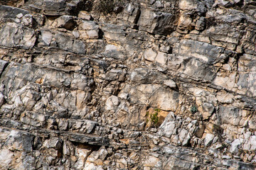 Fondo de piedra marrón rojiza. Superficie rocosa. Textura de montaña. Primer plano. Fondo de roca brillante para tus diseños.	