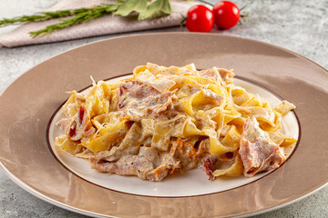 Italian pasta fettuccine with prosciutto