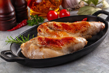 Roasted rabbit leg served rosemary