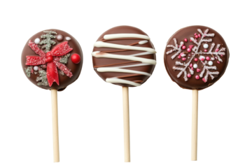 Chocolate cake pops with decorative swirls and sprinkles isolated on transparent background. Christmas chocolate lollipops isolated on white background.