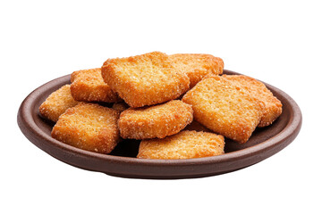 Crispy golden crackers nuggets in a rustic bowl isolated on transparent background. Crispy crackers arranged neatly on a plate isolated on white background.