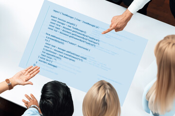 A dynamic group of diverse individuals collaborates over a coding document. Engaged in meaningful discussion, they explore programming concepts in a modern workspace. Trope