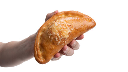 Delicious stuffed pastry held in hand showcasing golden brown crust and cheese topping