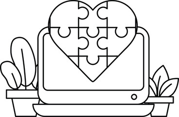 A puzzle piece heart is on a computer monitor