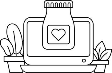 A laptop computer is on a table with a bottle of medicine next to it