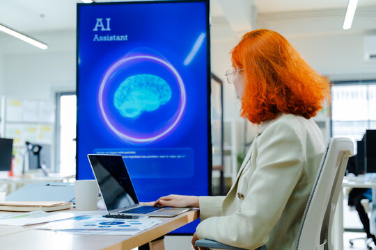 Business woman use artificial intelligence AI technology for solve work problems,enhanced work efficiency data analysis,efficient tools,Unlocking work potential,AI technology in corporate setting
