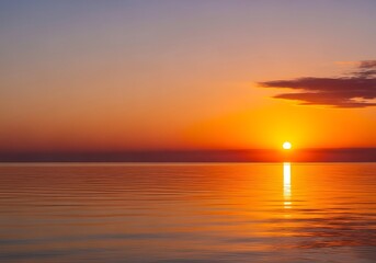 Sunset over calm ocean water with vibrant orange and purple sky  