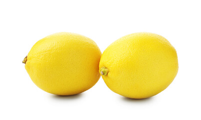 Two whole ripe lemons isolated on white