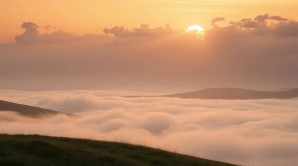 Obraz premium soft golden sunlight shining above foggy clouds at dawn forming dreamy warm natural sunrise landscape scene