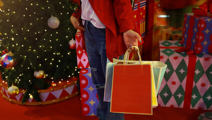 Woman hand pick up of the colorfull of shopping bag at the store retail