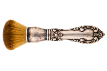 Vintage makeup brush with an ornate tarnished silver handle isolated on a transparent background