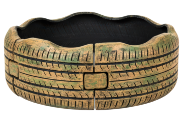 Garden planter pot made from a painted recycled car tire isolated on a transparent background