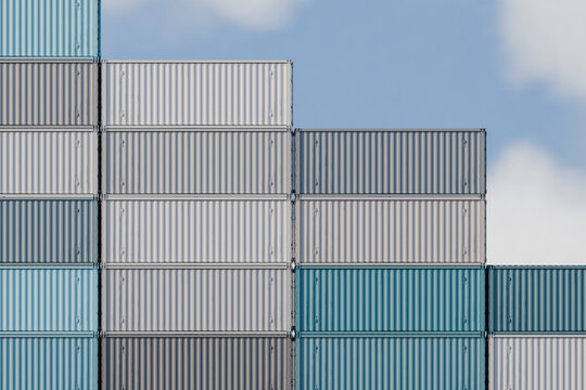 Stacked cargo containers outdoors in shipping yard for transportation