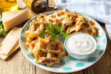 Crispy cheese waffles on a rustic background.