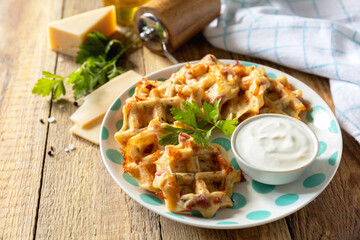 Crispy cheese waffles on a rustic background. Copy space.