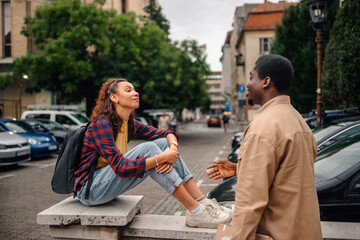 Students talking on city street during break from class