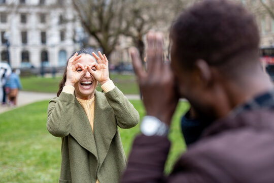 Playful couple enjoying time together outdoors in the park