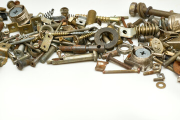 Different iron bolts, nuts, washers, fasteners scattered.Metal sundries,mess
