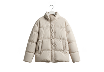 A beige puffer jacket hanging on a white hanger against black background