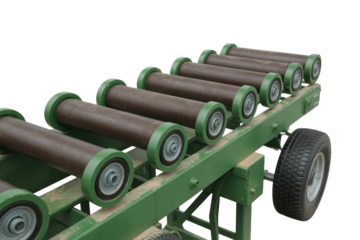 A mobile, green-framed industrial conveyor with multiple brown rollers and a wheel, used for processing materials, against a transparent background. background removed