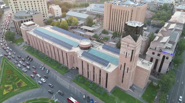 Drone aerial view of Yerevan Municipality in downtown Yerevan, Armenia. The video showcases the landmark government building with its unique architecture, surrounded by busy streets, cars, and the mod