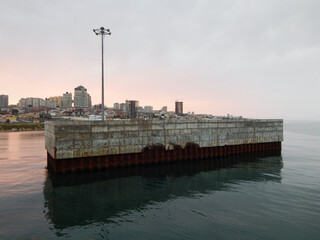 Concrete pier at sea.