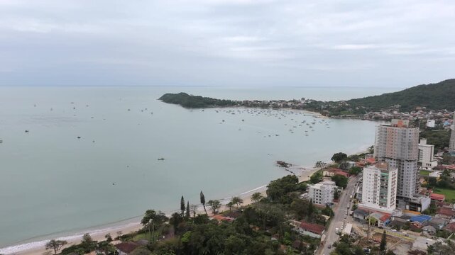 Aerial view of Praia do Trapiche coastline and urban area in Penha Santa Catarina Brazil, coastal tourism and real estate development