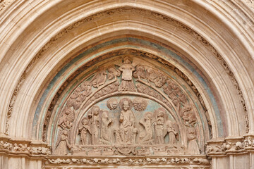 Romanesque arcade apocalypse scene. Sta. Maria Basilica. Puerta perdon. Spain