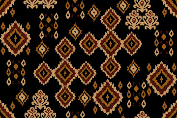 Brown Geometric Tribal Ikat Pattern on Black Background. Motifs African boho paisley Floral Ikat embroidery border. Ethnic ikat floral Ethnic Indian Pattern. perfect for fabric prints, wallpapers