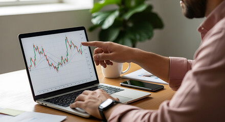 Financial Analyst Reviewing Stock Market Trends on Laptop Screen at Home Office, Analyzing Investment Portfolio Performance, Charting Data for Strategic Decisions and Growth