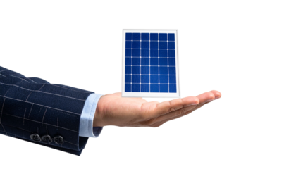 A person holding a solar panel in their hand showcasing renewable energy