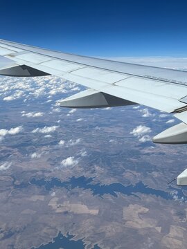 Aerial view of Cabeza del Buey from airplane window with plane wing visible