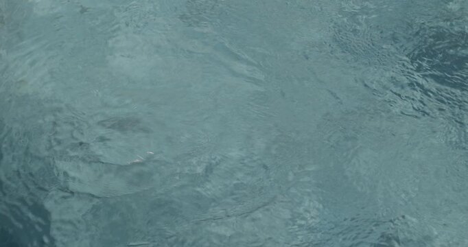 Close-Up of Pool Water with Circular Motion from Massage Jet