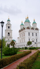 View of the Astrakhan Kremlin with the Assumption Cathedral and the bell tower on a cloudy day. Astrakhan, Russia