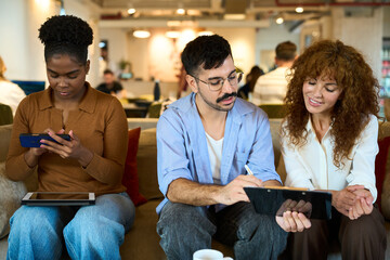 Diverse team collaborating in a relaxed coworking space - Financial, insurance and legal advisory