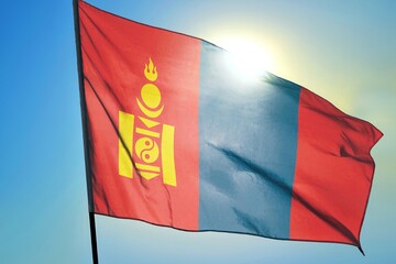 Mongolia national flag waving in sunlight close-up – Mongolian tricolor red blue red banner with...