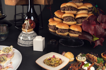 Assorted gourmet canapés on white plate with creative toppings