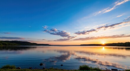 Fototapeta premium Serene sunrise over a tranquil lake