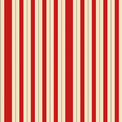 Obraz premium Vertical red and cream striped pattern suitable for various design applications and backgrounds