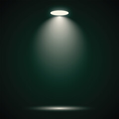 Bright stage spotlight beam illuminates a dark green empty space