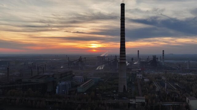 Aerial drone view of Industrial steel factory, iron works. Metallurgical plant. steelworks. Heavy industry in Europe, Poland, Dabrowa Gornicza. Air pollution from chimneys. Ecology and environmental