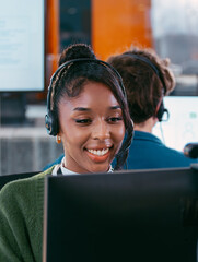 Telemarketing, Young Female Customer Service Agent talking, typing and helping client via headset using computer in call center office. Professional Female IT Support, Operator talk with client.