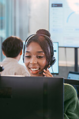 Focused Female Call Center Specialist Sitting at Desk with Headset. Professional Customer Service Agent Talking to Client, Providing Online Assistance, Technical Support, Helpline, CRM Support office