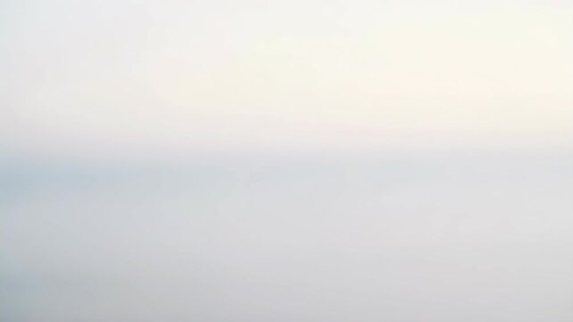 An ethereal landscape of sky and water, softly blurred and faded