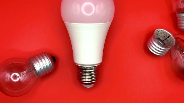 Modern LED lamp, saving electricity. Tungsten light bulb lamp. Non-working light bulb, broken light bulb. Concept of light and dark, idea, electricity copy space, flay lay, top view. High quality
