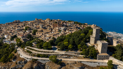 Aerial view of Erice, a small town located in the province of Trapani, Sicily, Italy. In foreground is Venus Castle, a medieval fortress. On the horizon, is the Mediterranean Sea. © Stefano Tammaro